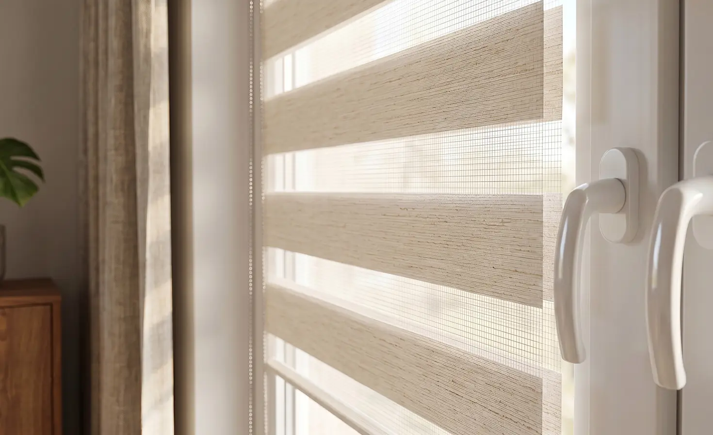 Close-up of a beige day-and-night blind on a window.